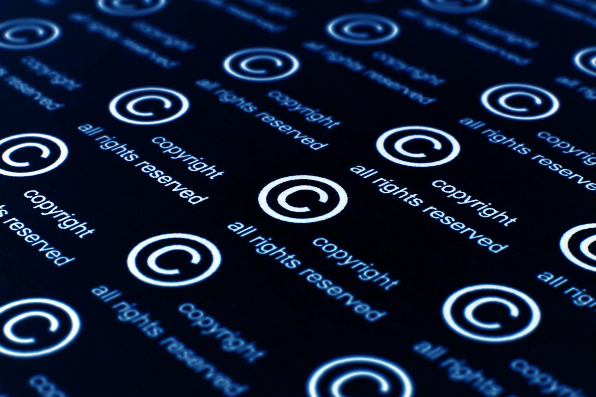 A group of copyright symbols on a black background.