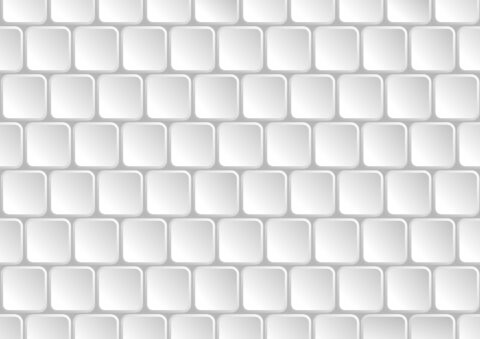 A pattern of white square tiles with rounded edges, arranged in a grid formation on a light background.